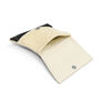 An open white clutch bag with magnetic closure and embellished with dark beads.