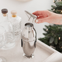 A penguin shaped, stainless steel shaker with built in strainer.