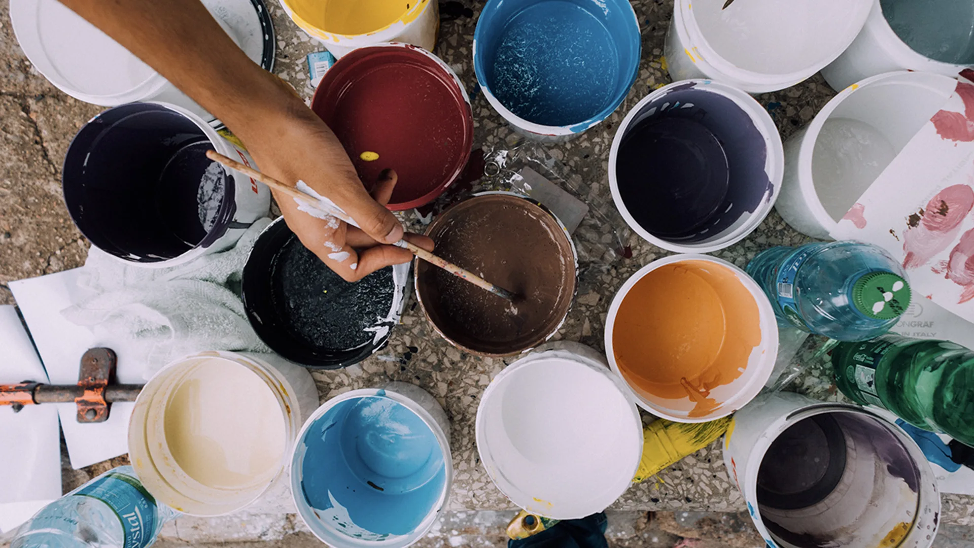 Close up of artist using assorted colour paints